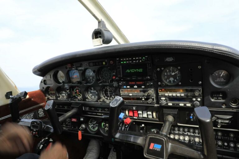 Detailed cockpit view of a small aircraft in flight