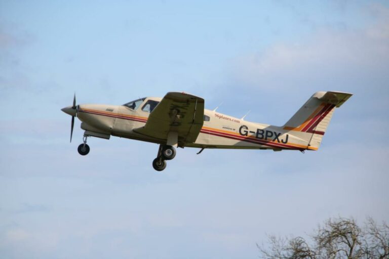 Small aircraft flying against a clear sky