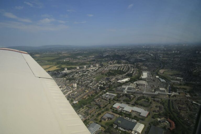 Aerial view of city from airplane wing