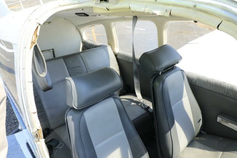 Interior view of aged aircraft with grey seats