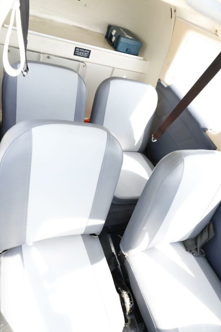 Bright interior view of empty aircraft seats