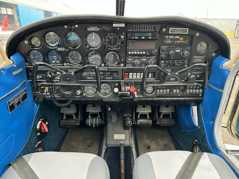 Detailed view of airplane cockpit instruments and controls
