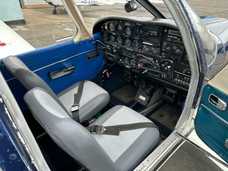 Interior view of blue small aircraft cockpit